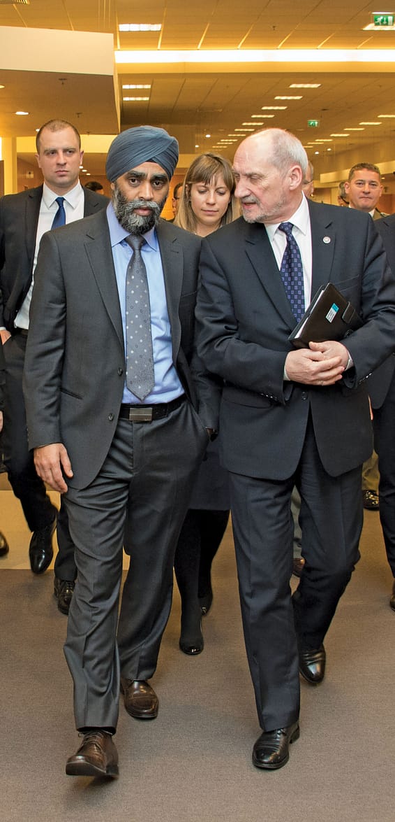 Defence Minister, Harjit S. Sajjan speaks with Antoni Macierewicz, his counterpart from Poland during the annual Defence Ministerial Meeting at NATO Headquarters in Brussels, Belgium on February 10, 2016. Photo: Sgt Yannick Bédard, Canadian Forces Combat Camera. IS01-2016-0001-010 ~ Le ministre de la Défense, Harjit S. Sajjan, discute avec Antoni Macierewicz, son homologue polonais, lors de la réunion des ministres de la Défense au siège de l’OTAN à Bruxelles (Belgique), le 10 février 2016. Photo : Sgt Yannick Bédard, Caméra de combat des Forces canadiennes. IS01-2016-0001-010