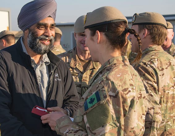 The Honourable Harjit S. Sajjan, Minister of National Defence, presents medals to the members of CANSOF Task Force during a visit to Iraq on December 21, 2015. Photo: Sgt Yannick Bédard, Canadian Forces Combat Camera. IS01-2015-0007-040 ~ L’honorable Harjit S. Sajjan, ministre de la Défense nationale, remet des médailles aux membres de la COMFOSCAN lors d’une visite en Irak, le 21 décembre 2015. Photo : Sgt Yannick Bédard, Caméra de combat des Forces canadiennes IS01-2015-0007-040