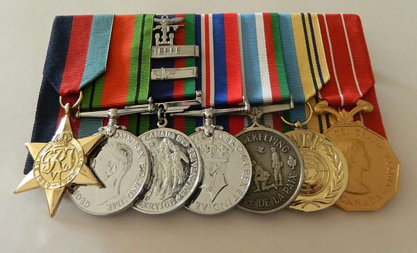 Raymond DeKelver's medals (from left): The 1939-1945 Star; The Defence Medal; The Canadian Volunteer Service Medals with Overseas Bar and Dieppe Bar; The 1939-1945 War Medal; The Canadian Peacekeeping Service Medal; The United Nations Emergency Force Medal; The Canadian Forces Decoration. DeKelver never saw the complete set.